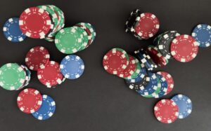 Casino chips in various colors flat on a table